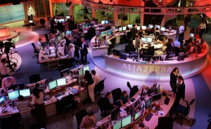 Staff work at the English-language newsroom at the headquarters of the Qatar-based Al Jazeera satellite channel in Doha