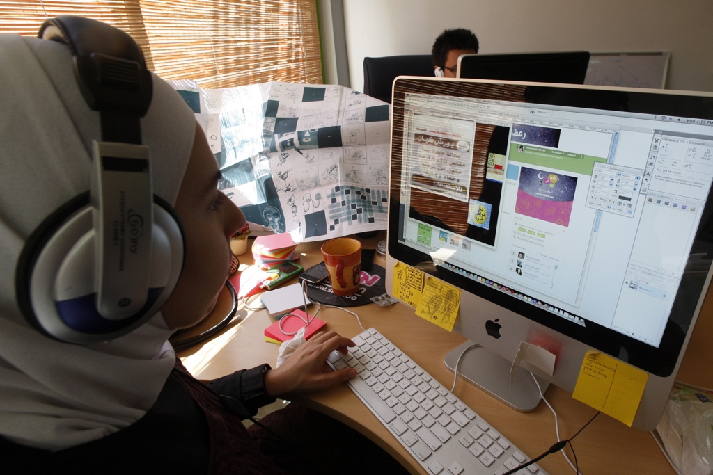 Middle Eastern woman browsing online