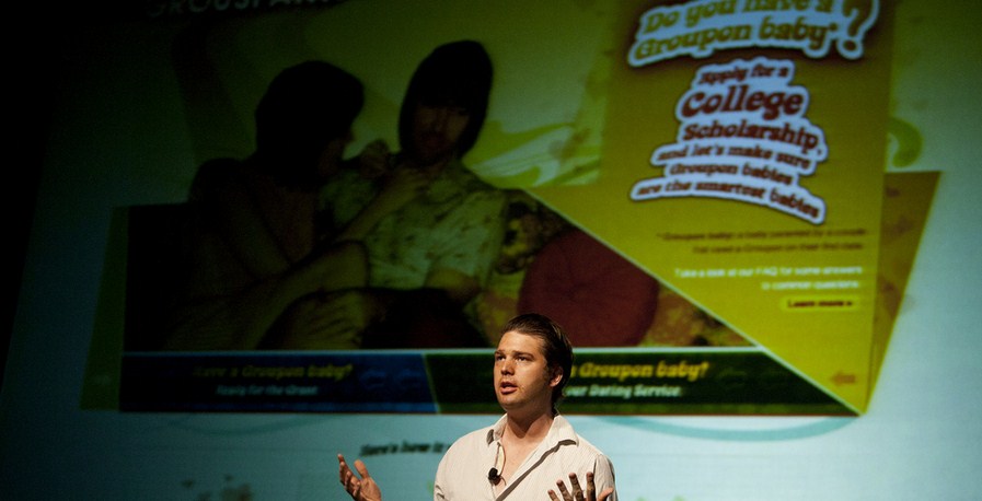 Groupon slides under $8 a share, setting yet another record low