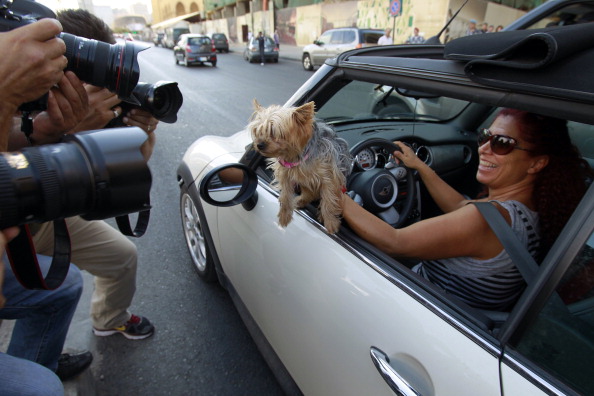 Photographers take pictures of a Lebanese member of BETA