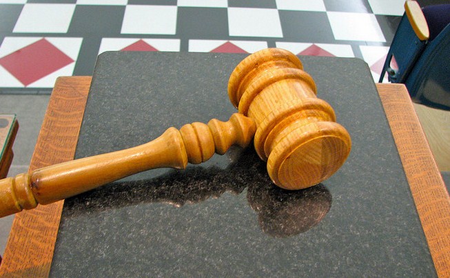 The U.S. government is suing eBay over a hiring pact with Intuit