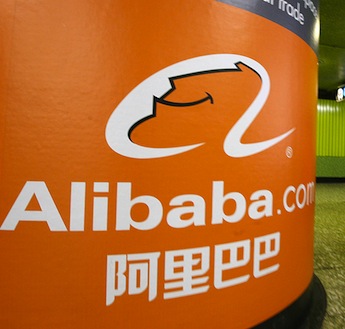 A pedestrian walks past Alibaba.com adve