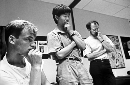 At-the-1990-Adobe-Photoshop-Invitational,-members-of-Adobe's-creative-team-(back-row,-from-left)_-Min-Wang-and-Russell-Brown-along-with-an-unidentified-artist,-1990