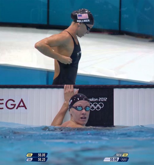 In the top image, taken just before the race began, you can see that Vollmer’s top swim cap is covering the strap of her goggles. In the bottom image, taken immediately after the race is over, the strap of her goggles is now on top of her bottom swim cap. 