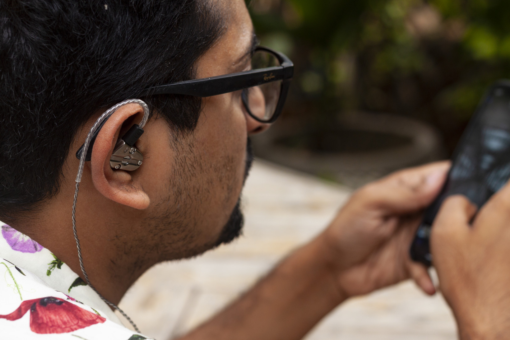 The RevoNext QT5 Earphones have plastic sheaths on the cable to allow it to sit snugly around your ears