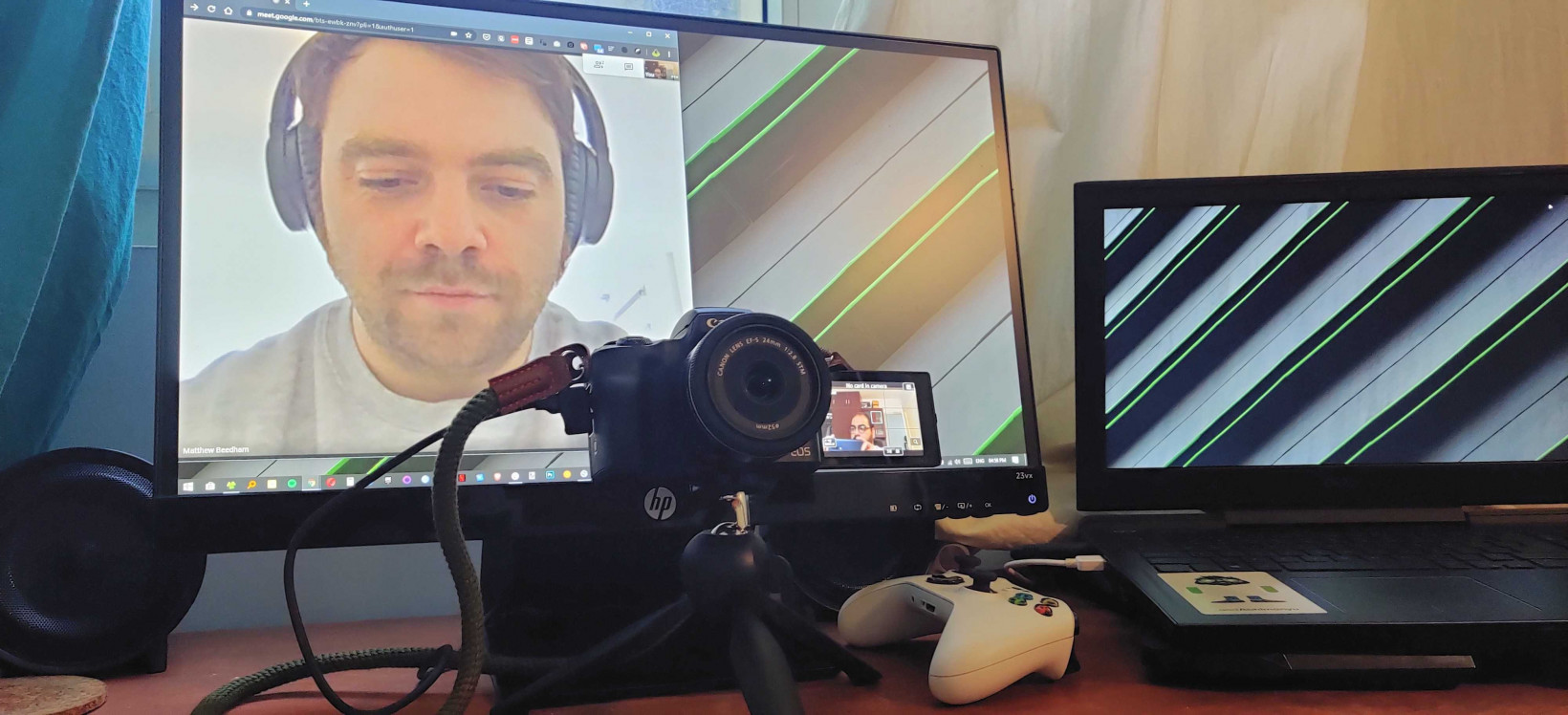 I've placed my camera in front of my monitor so I can look into the lens and also see other people on the call