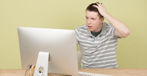 Person looking frustrated at computer
