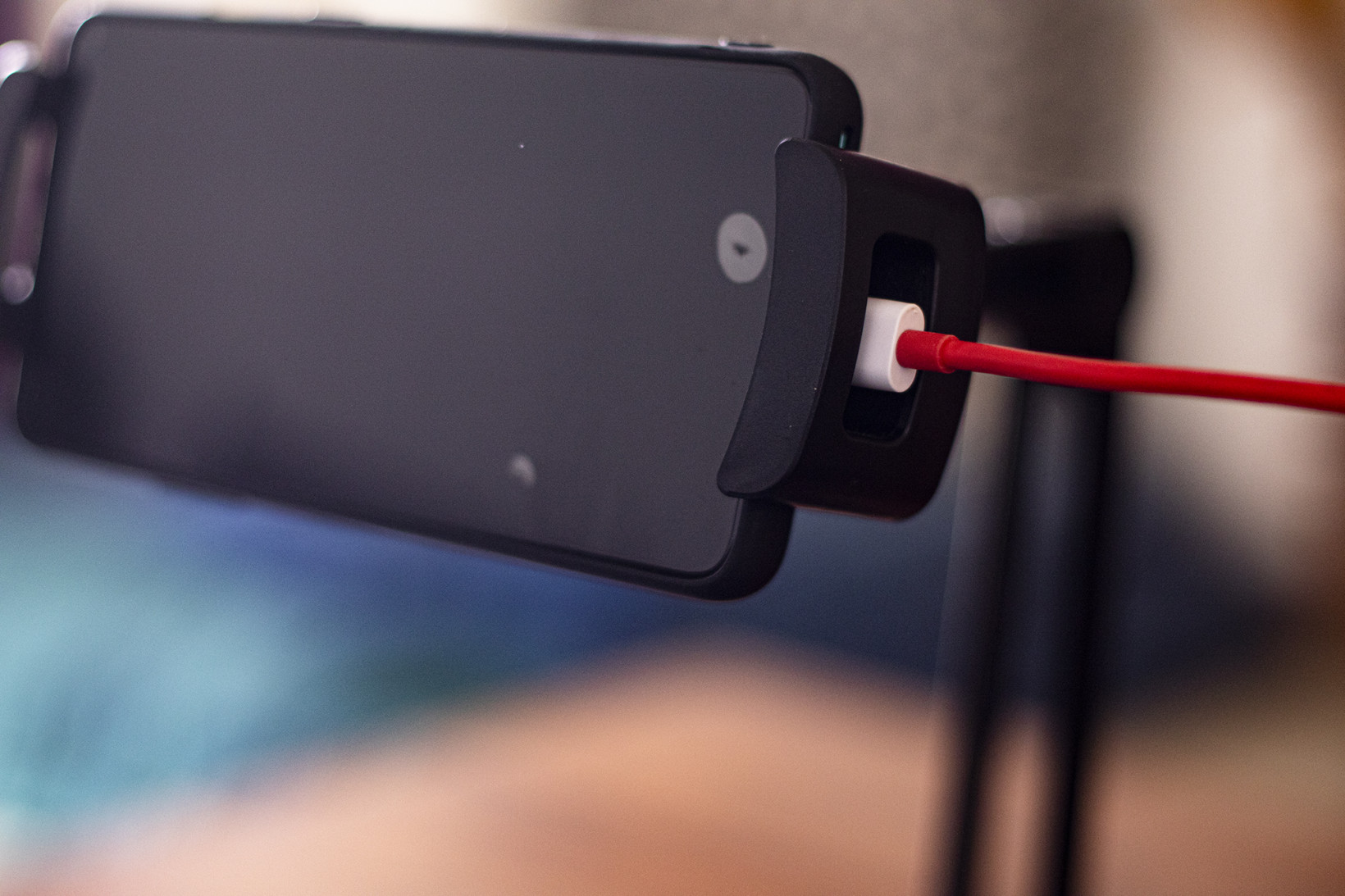 The HoverBar Duo has cutouts that let you connect a charging cable to your phone while in use