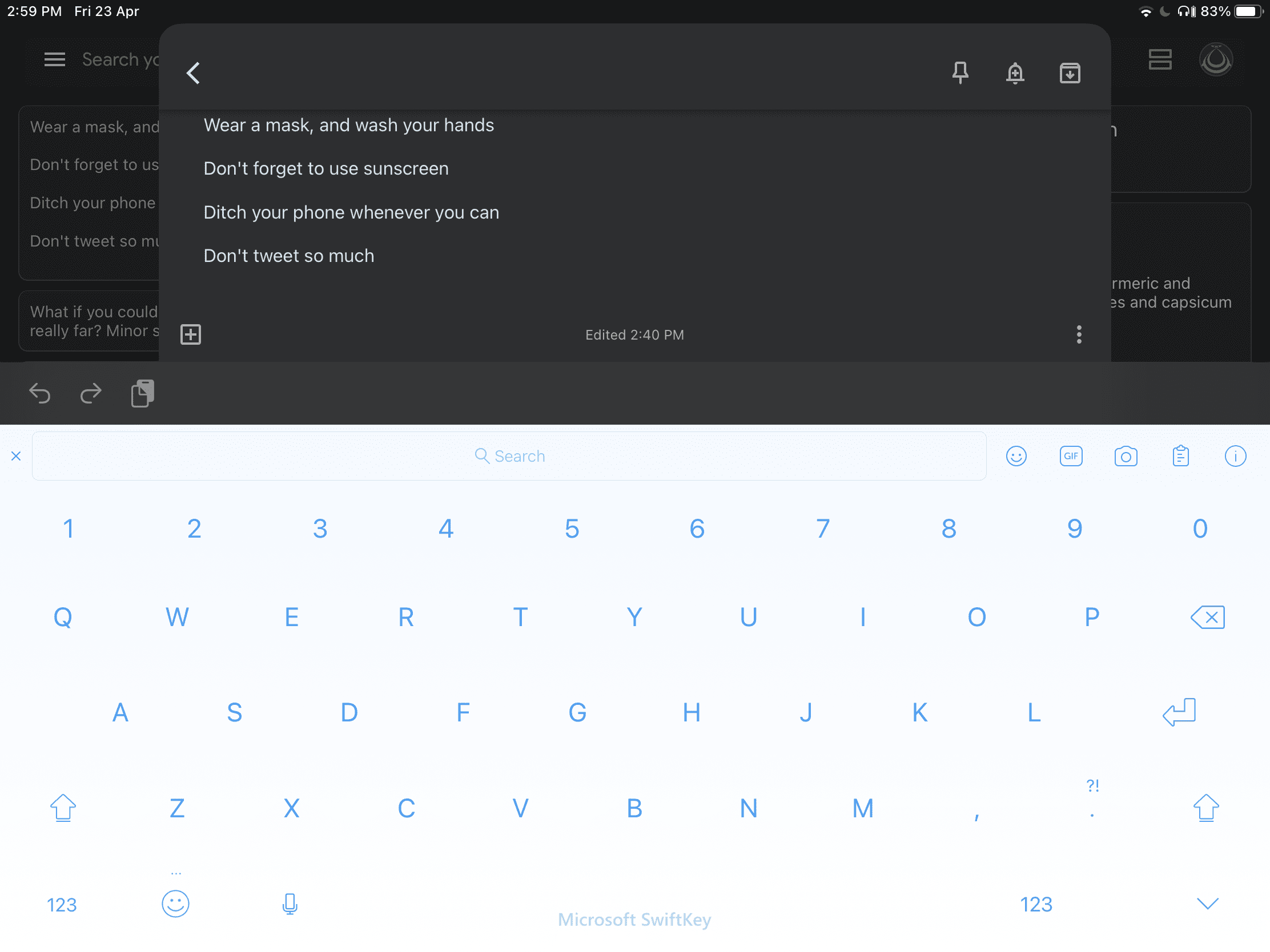 Find the clipboard button in SwiftKey's top row