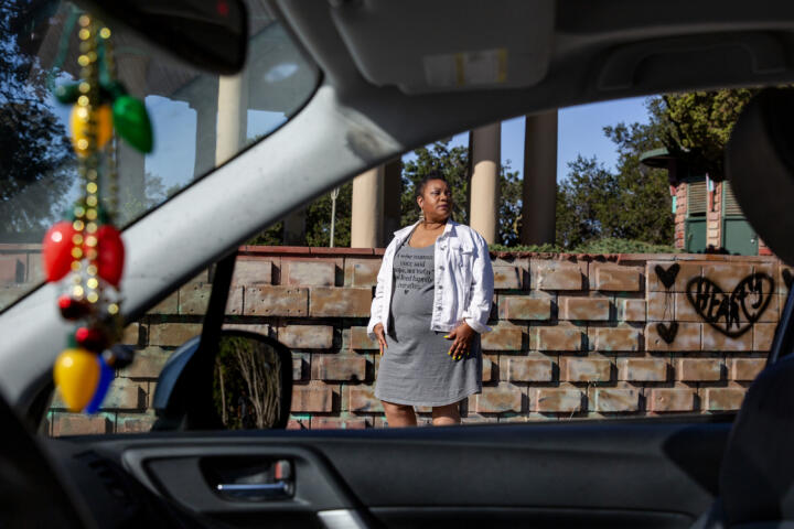 Mekela Edwards, a former Lyft and Uber driver, stands for a portrait outside of her car in Oakland, Calif. on Thursday, May 27, 2021. Image by Brittany Hosea-Small