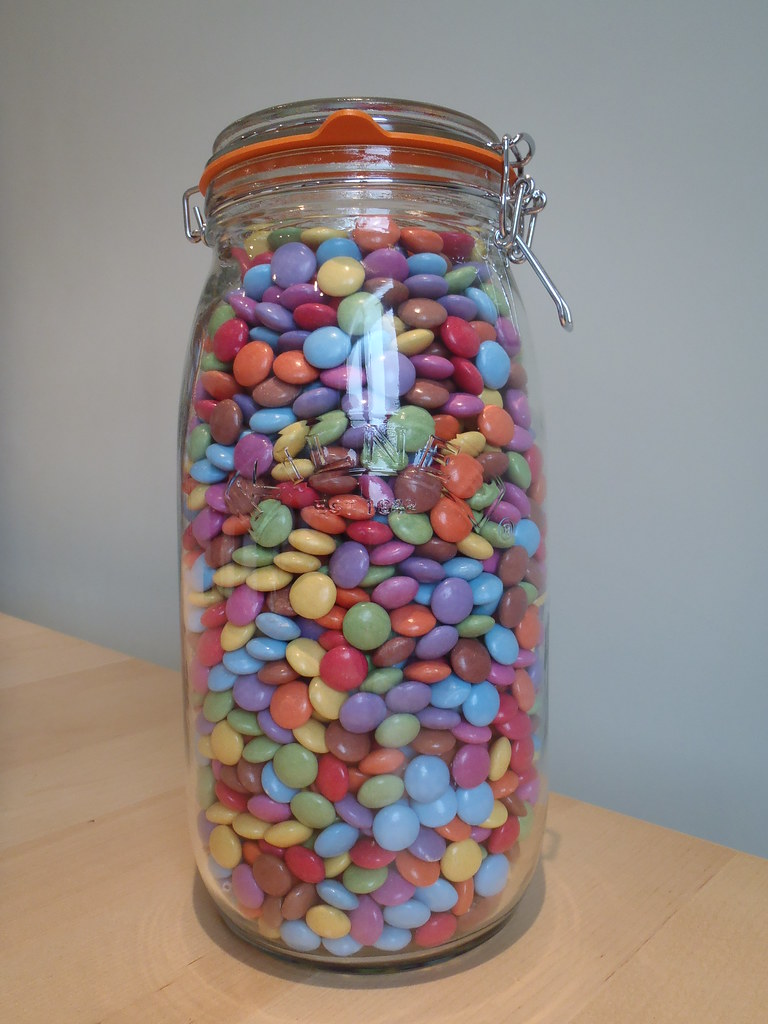 a jar full of colored candies