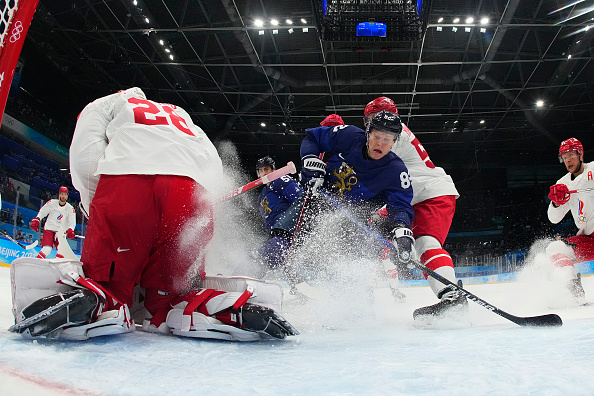 BEIJING, CHINA - FEBRUARY 20: Ivan Fedotov #28 of Team ROC stops a shot by Harri Pesonen #82 of Team Finland in the first period during the Men's Ice Hockey Gold Medal match between Team Finland and Team ROC on Day 16 of the Beijing 2022 Winter Olympic Games at National Indoor Stadium on February 20, 2022 in Beijing, China. (Photo by Matt Slocum - Pool/Getty Images)