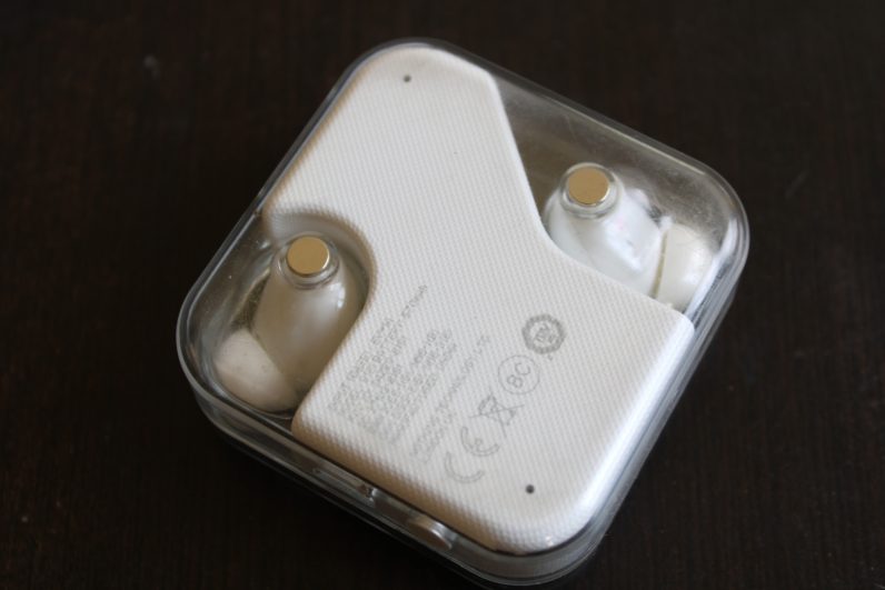 Scratches on the Nothing Ear 1's case after a few months of usage are visible.