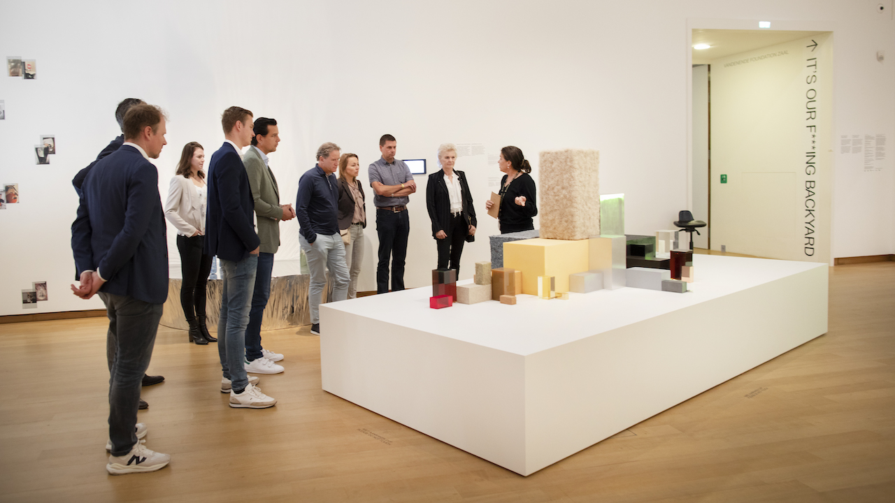 Participants at Future Talks: Sustainable Materials view Stedelijk Museum's sustainable design exhibition