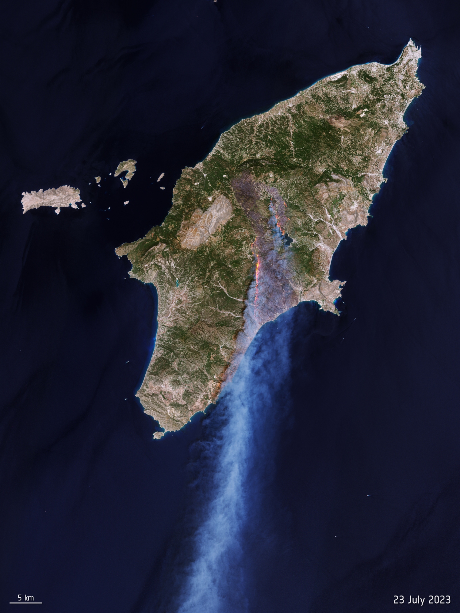 Breaking News a satellite tv for pc image of a wildfire burning on Rhodes island, Greece