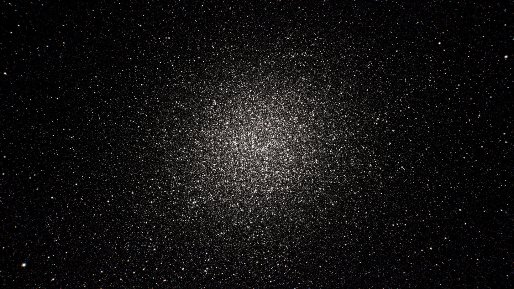 This image shows a star cluster set against a dark background. The further in towards the cluster’s centre, the higher the density of stars.