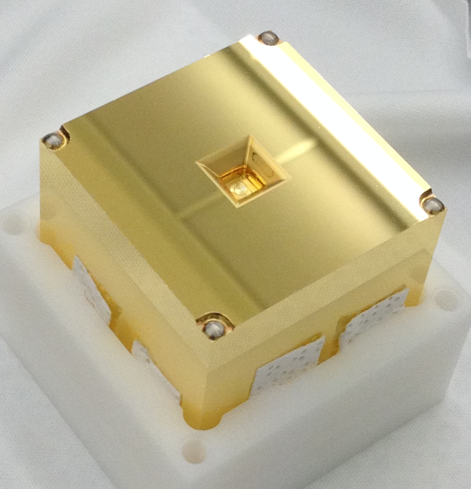 an image of the golden cubes that will be placed inside of all three LISA spacecraft