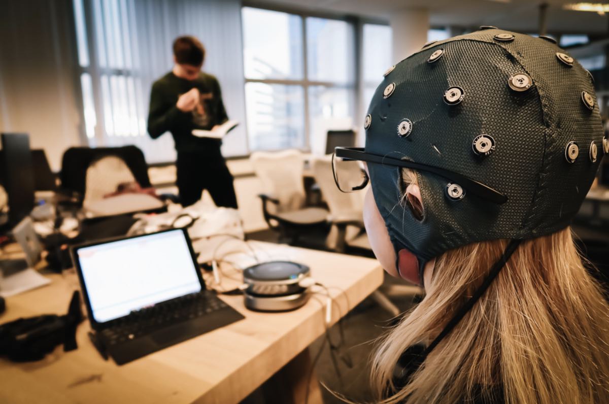 Image of a research participant in an EEG study with the EEG cap on