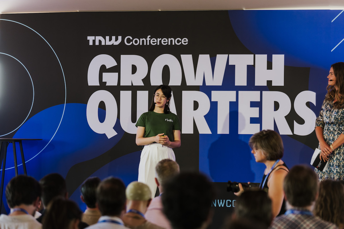 Isabell Trinh, Communications Specialist at Nostics, on stage at TNW's Pitch Battle Competition