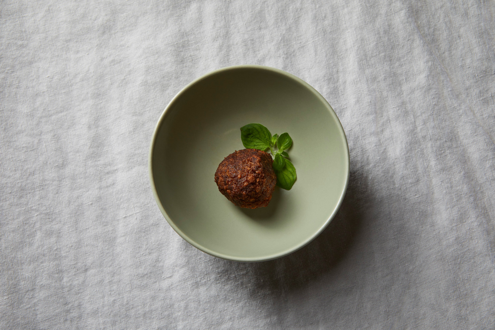 A vegetarian meatball made from mycoprotein on a plate